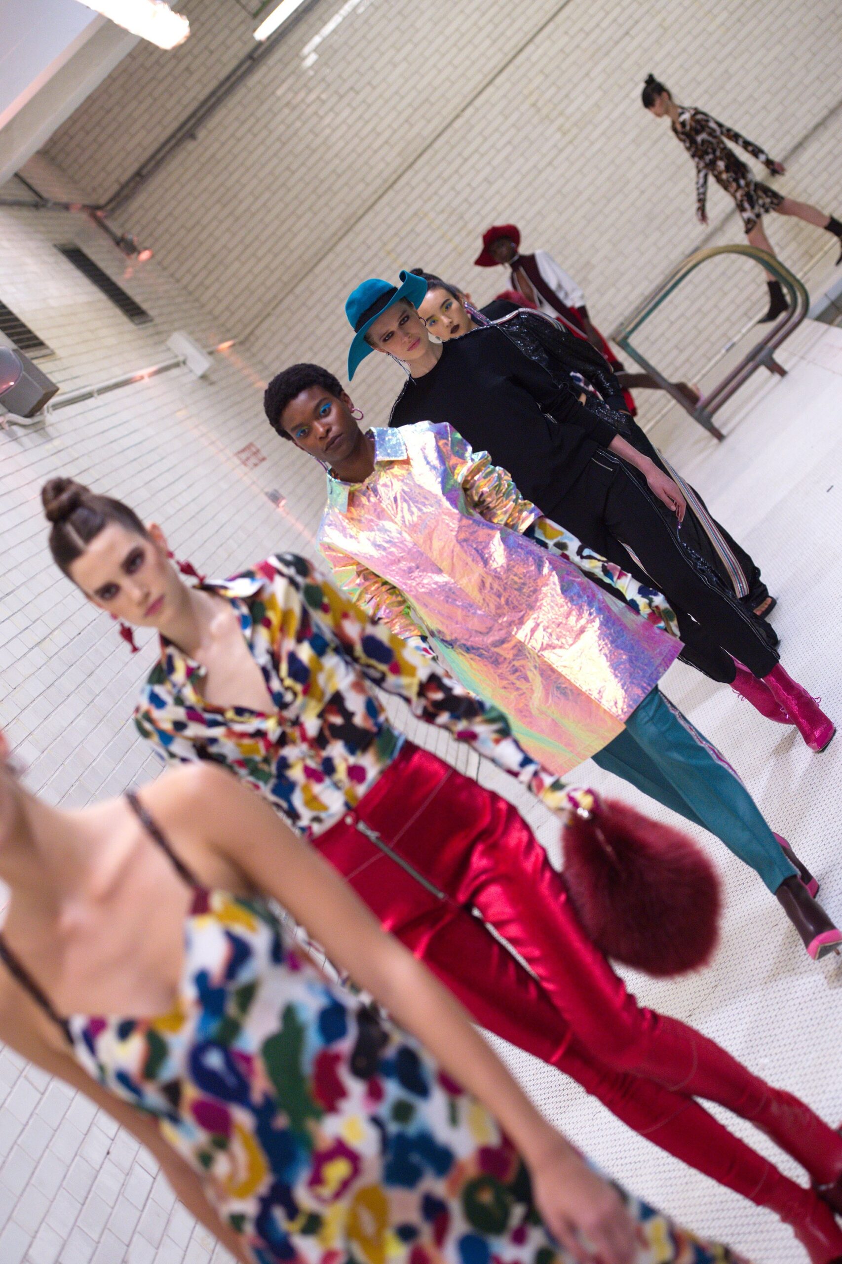 multi-colored silk dress and silver vinyl coat