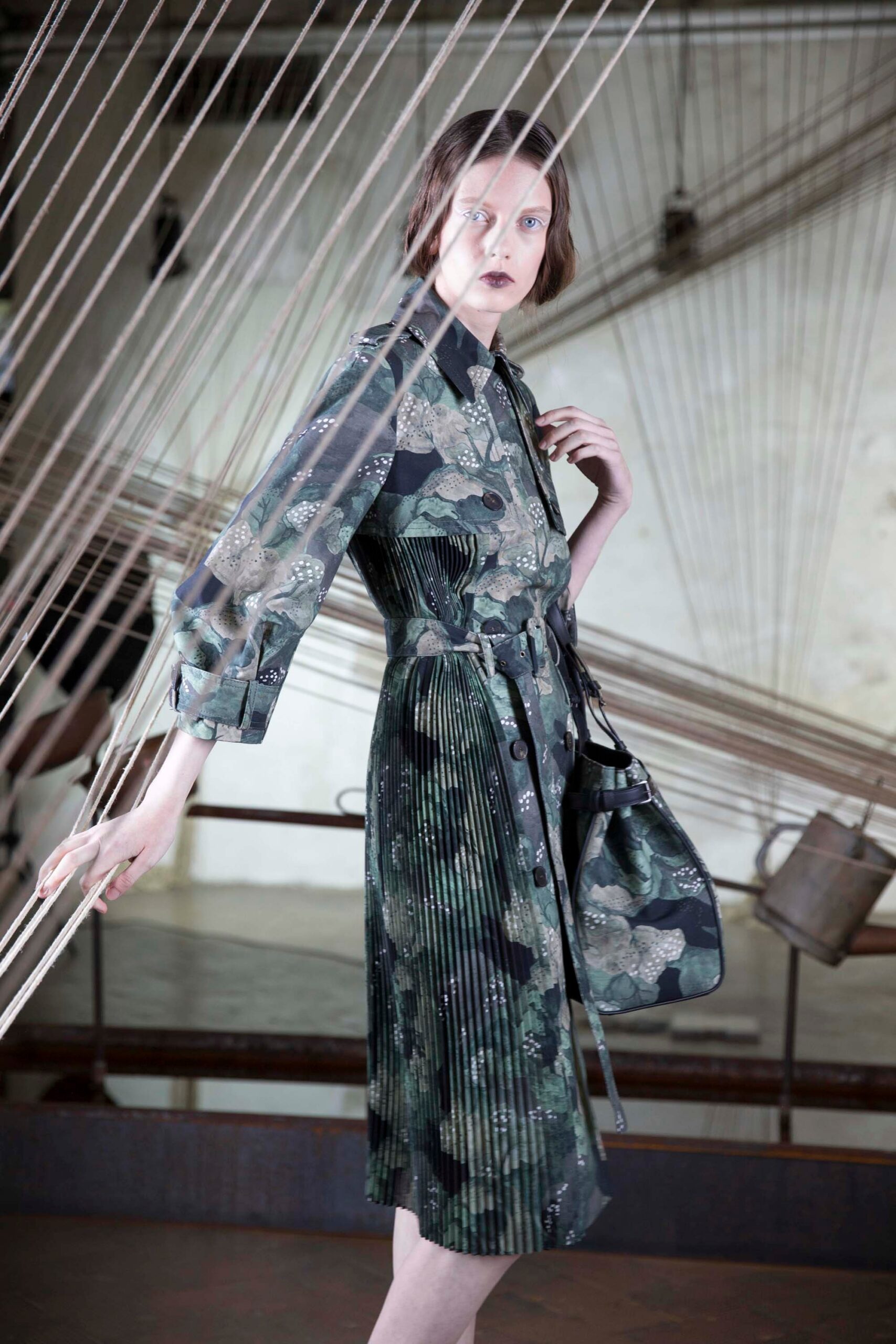 green pleated midi dress with bag