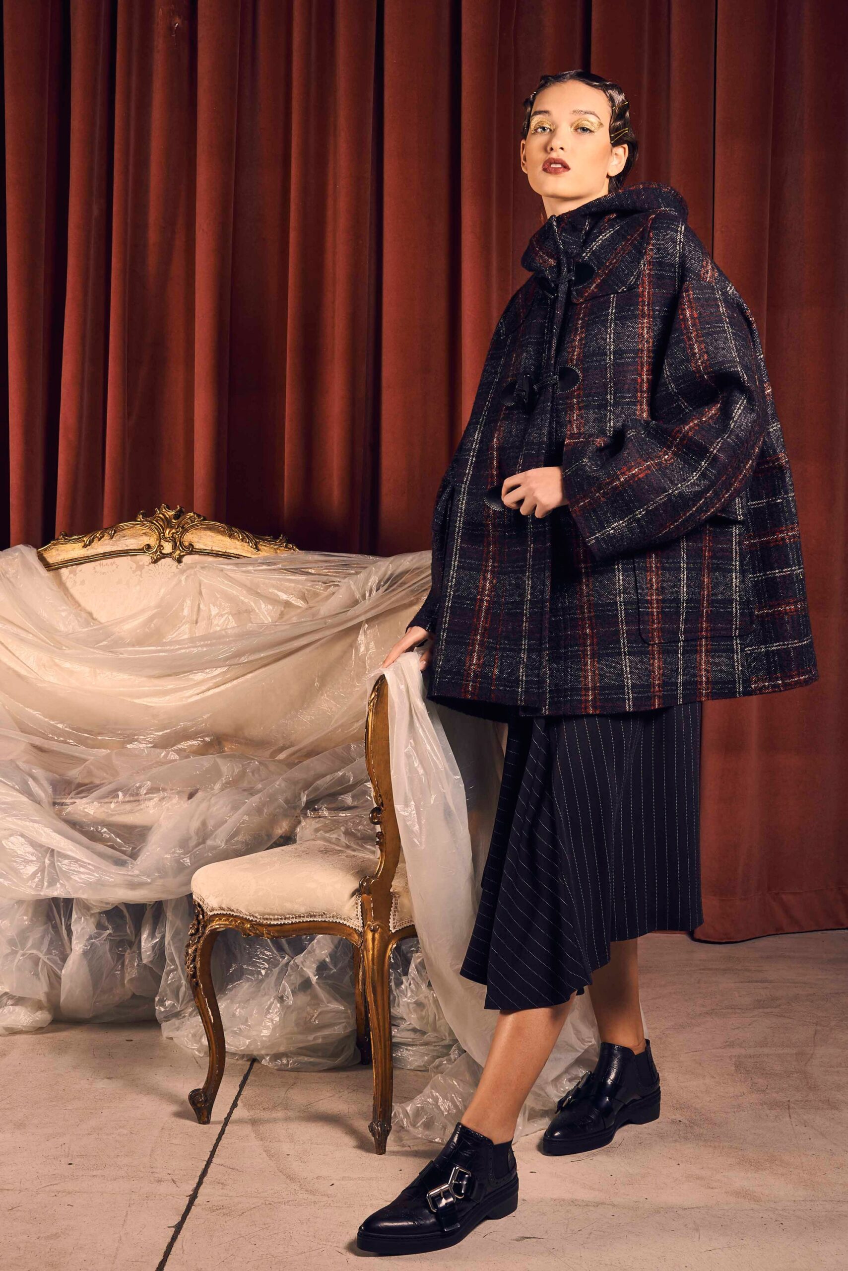 black and red checked cape with pleated skirt
