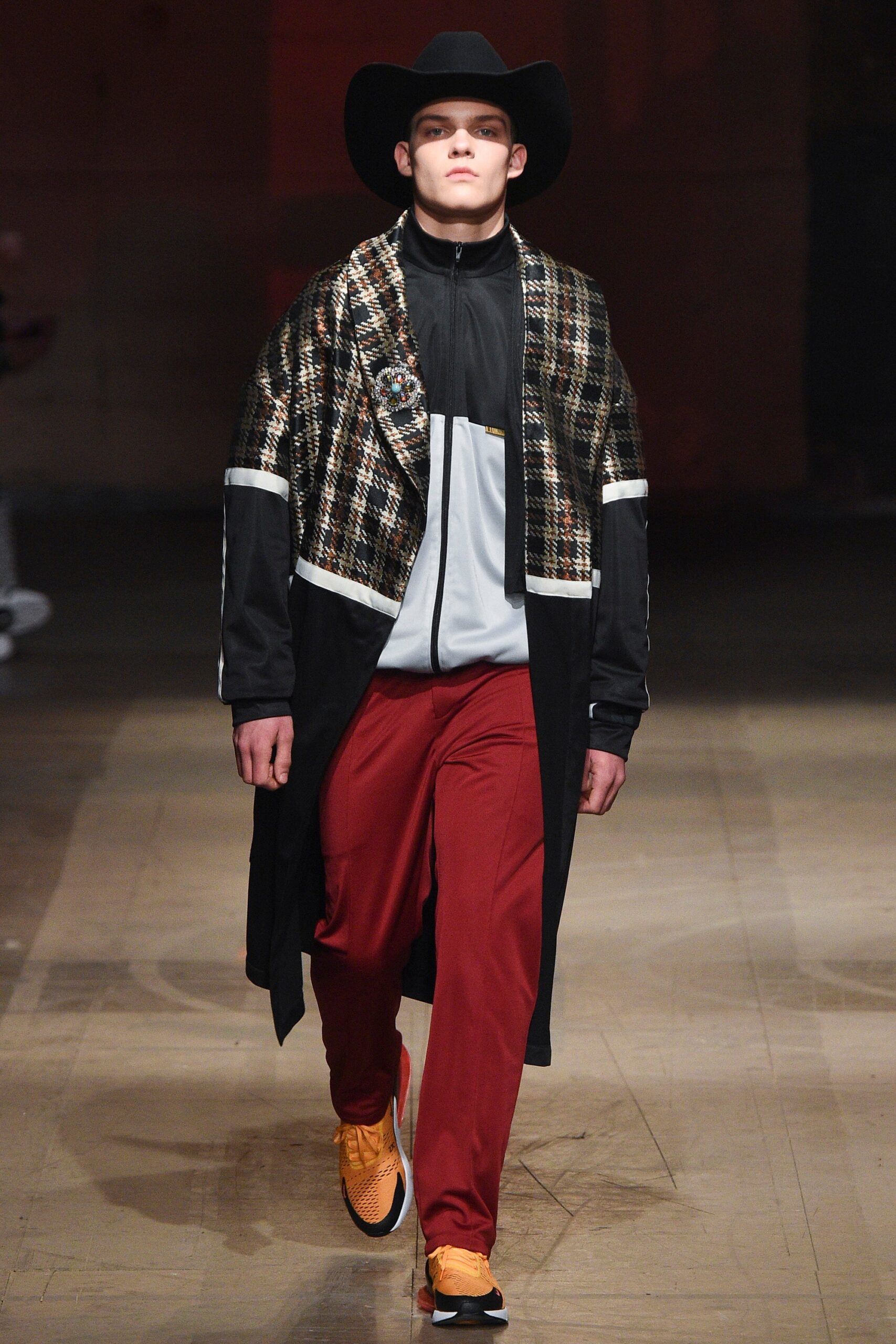 relaxed black coat with red pants