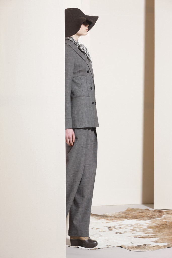 gray tailored suit with black hat