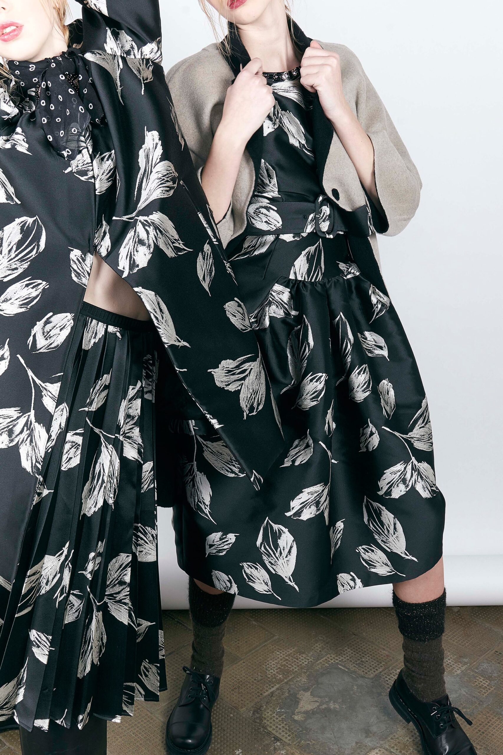 black silk flared dress and gray wool jacket