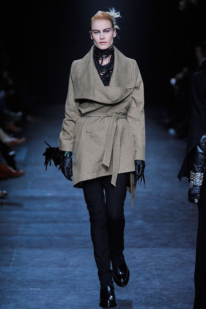 beige relaxed coat with black pants