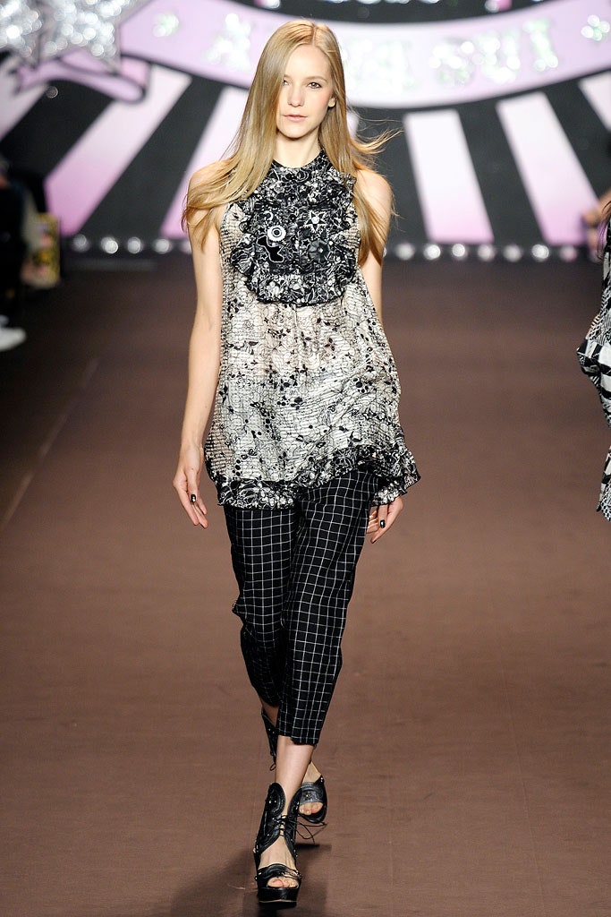 black and white ruffled top with checked pants