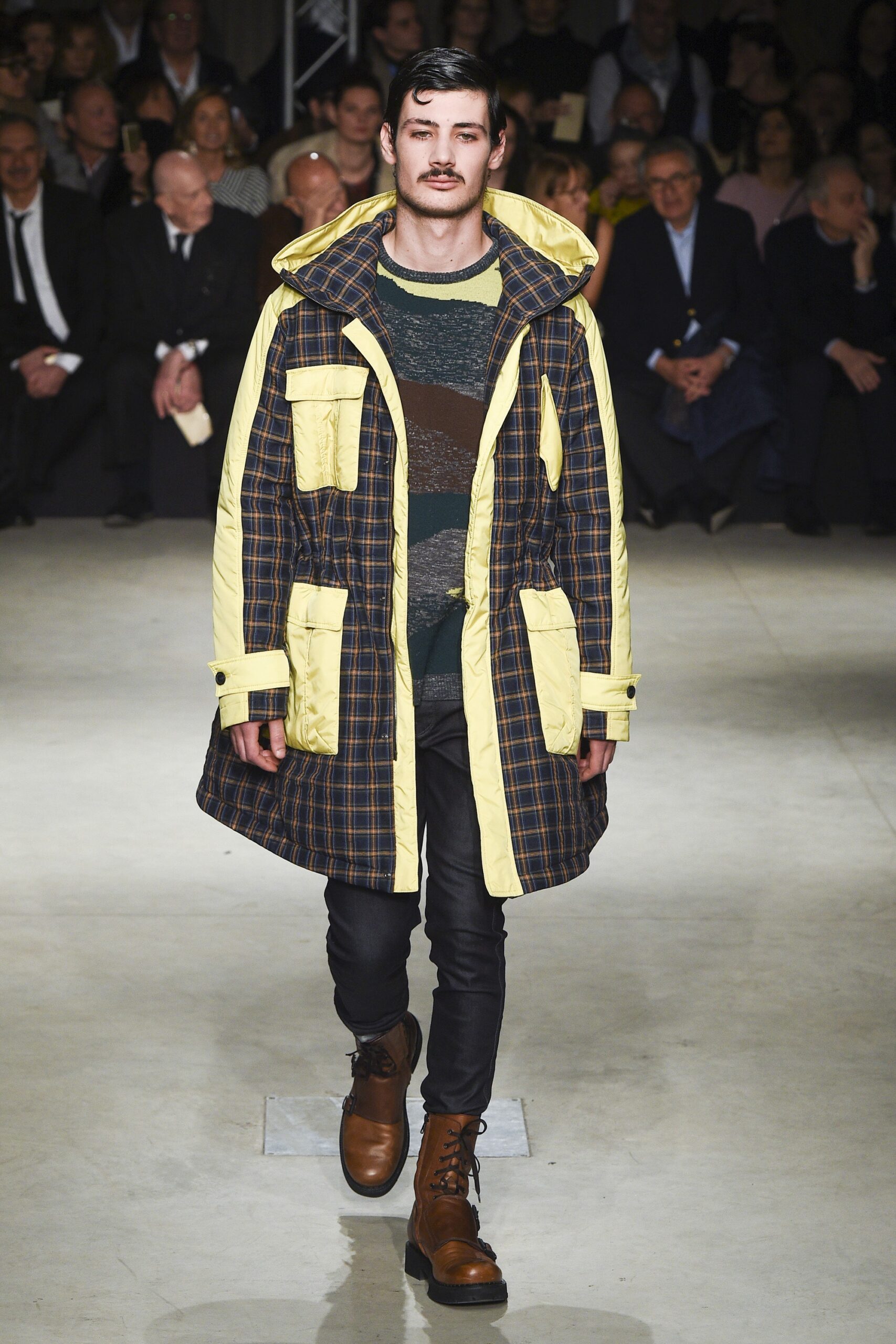 black and yellow parka with striped sweater