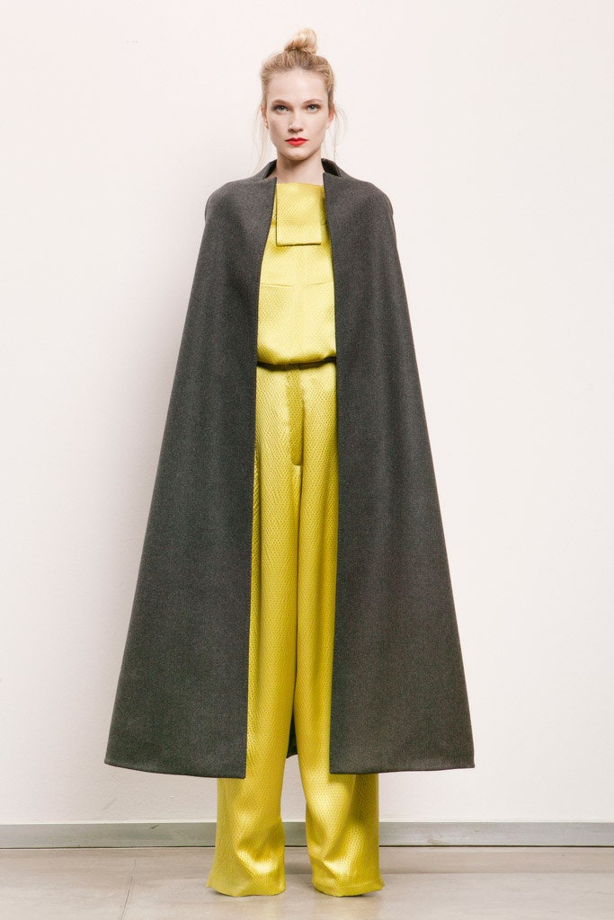 gray wool cape and yellow jumpsuit