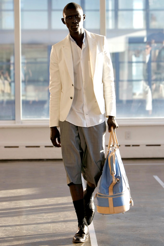 white tailored blazer with gray shorts