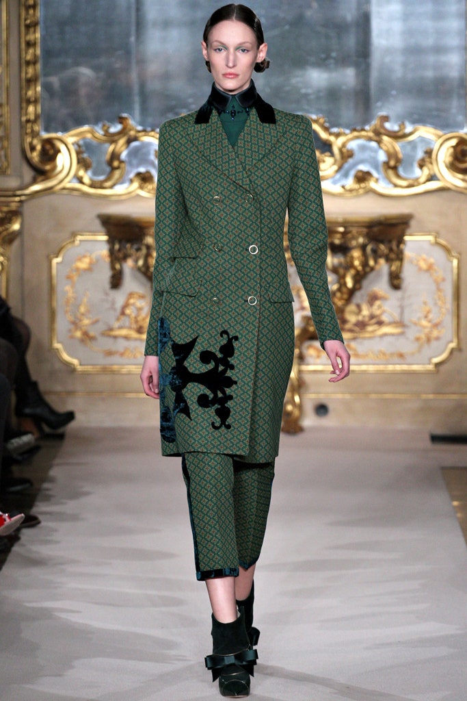 green tailored coat and pants