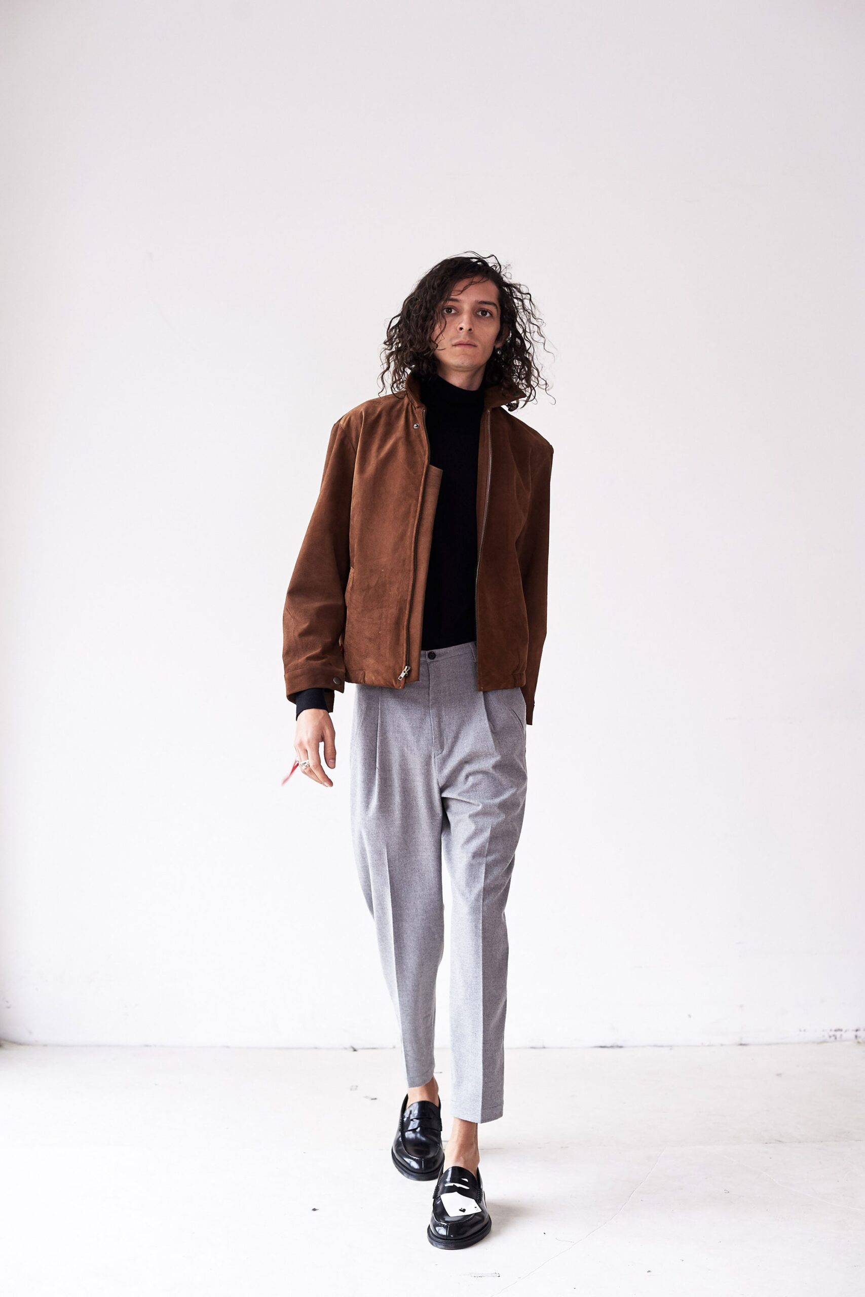 brown suede fitted jacket with gray pants