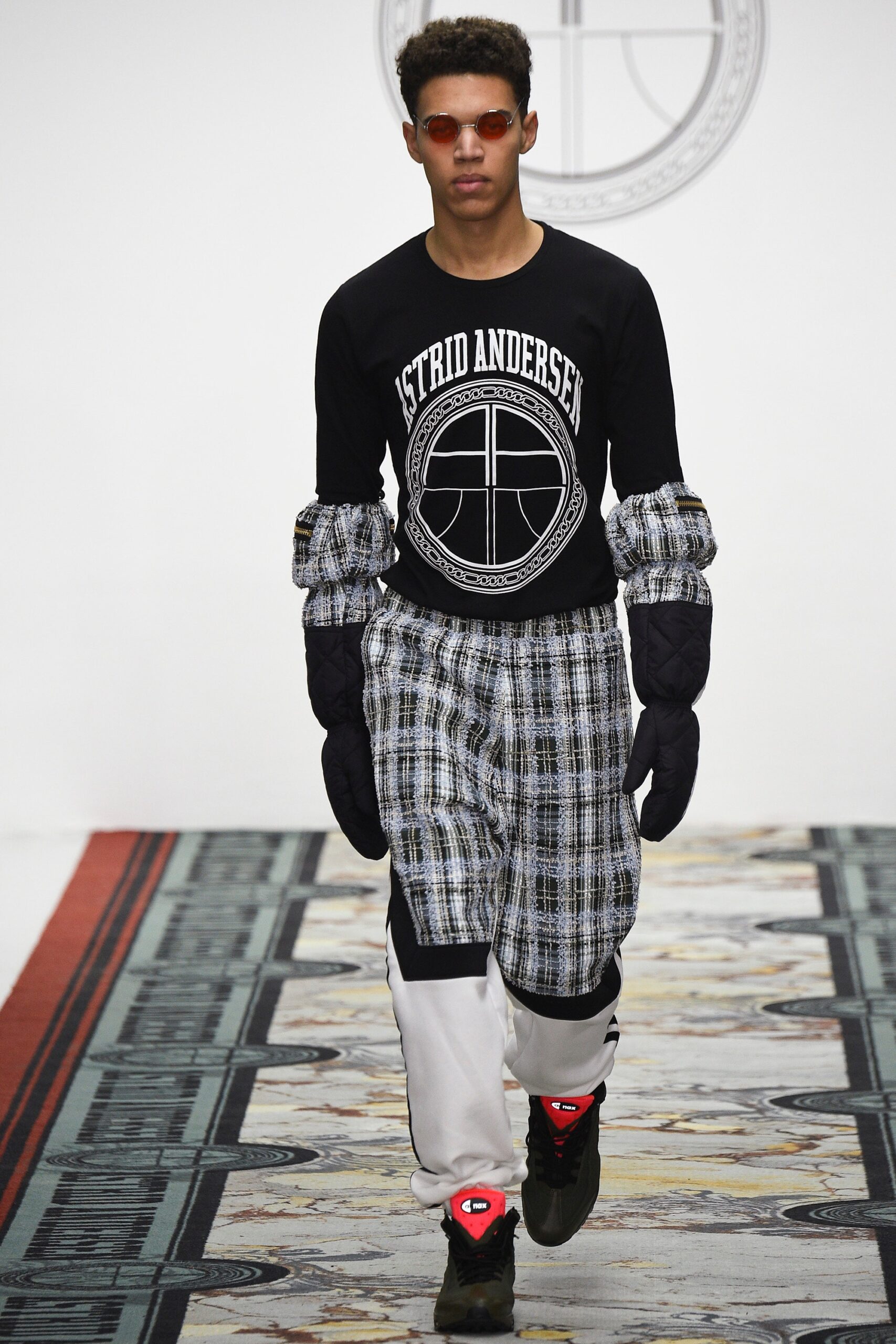 black printed top with gray pants