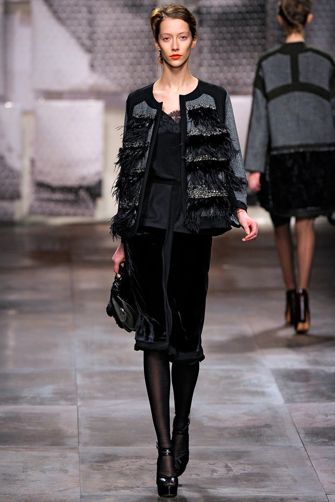 black fitted jacket and midi skirt