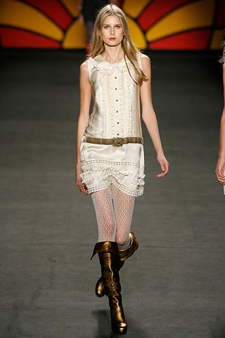 white mini dress with gold boots