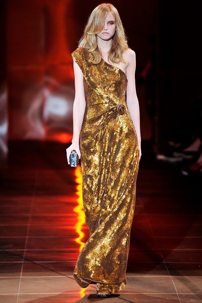 gold draped sleeveless gown