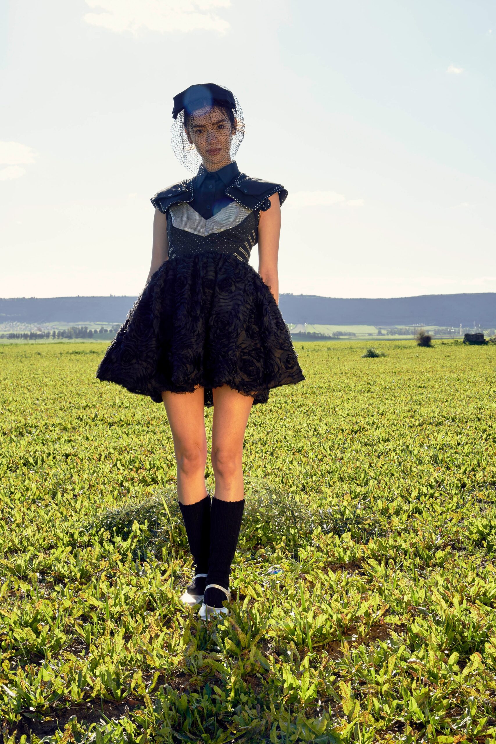 black cotton sleeveless high-neck fitted pleated a-line dress