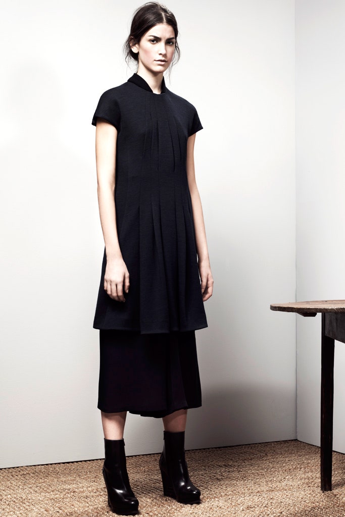 black pleated midi dress and boots