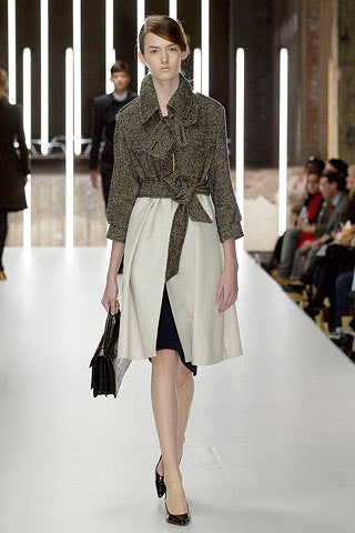 gray belted coat over navy dress