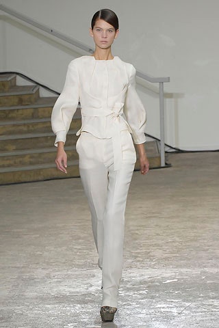 white silk fitted blouse and tailored pants