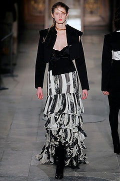 black structured jacket and tiered dress