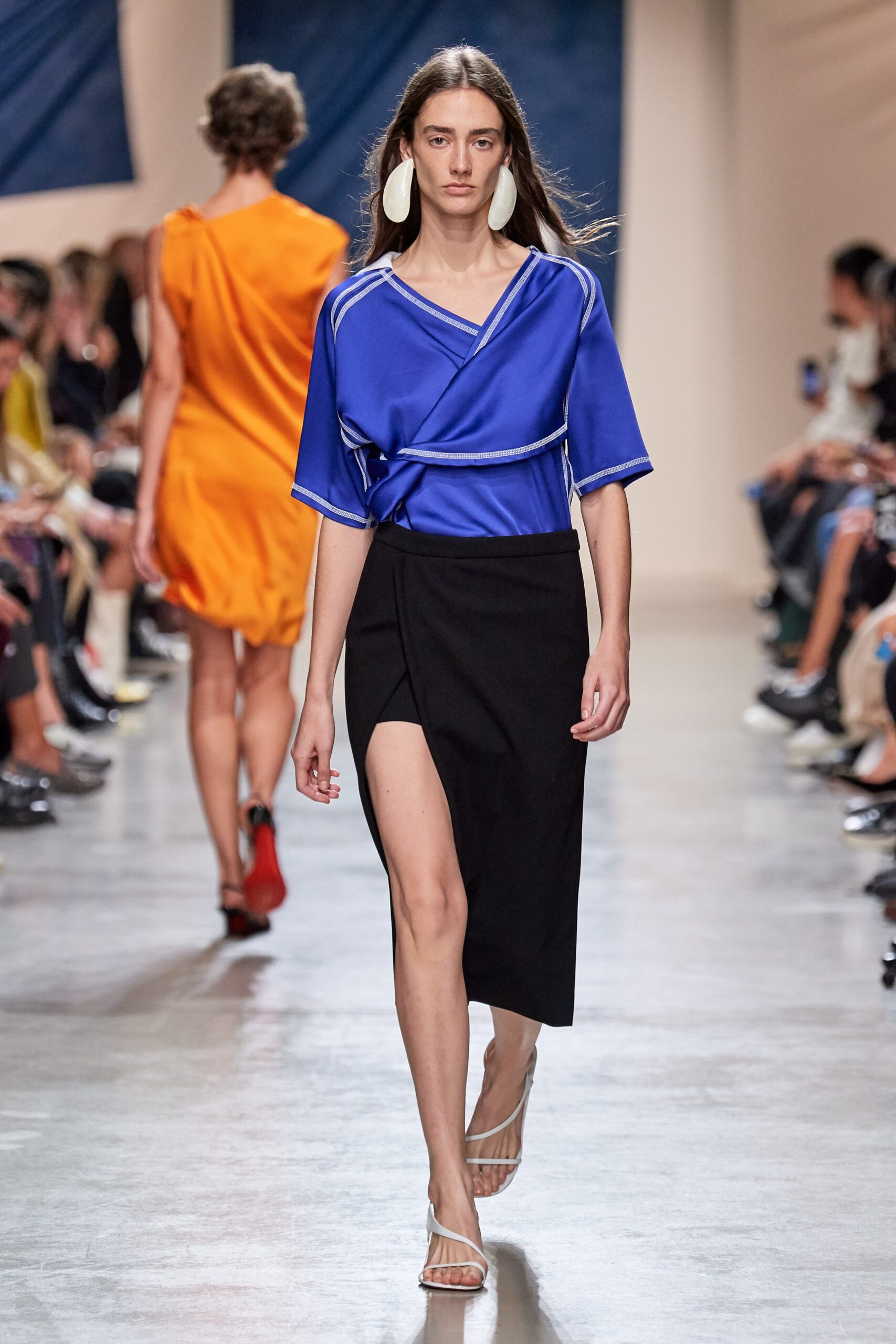 blue fitted top with black skirt