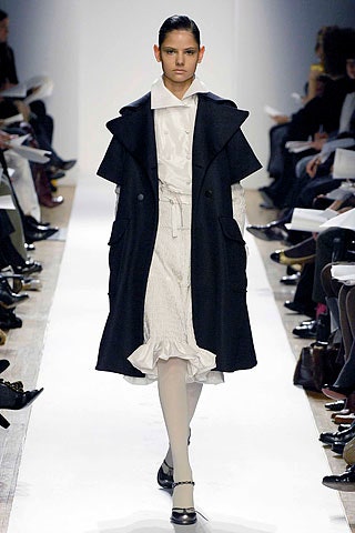 black wool coat and white dress