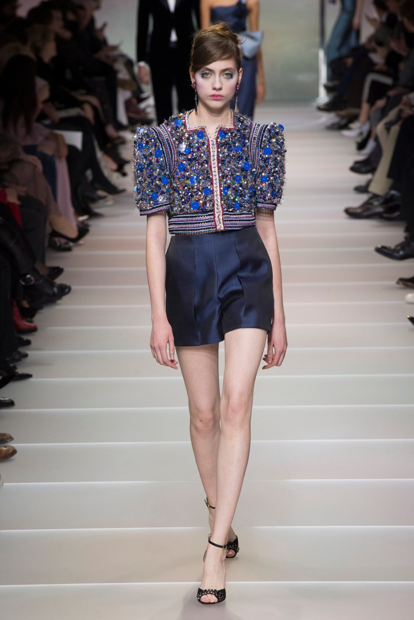 beaded blue top with black shorts