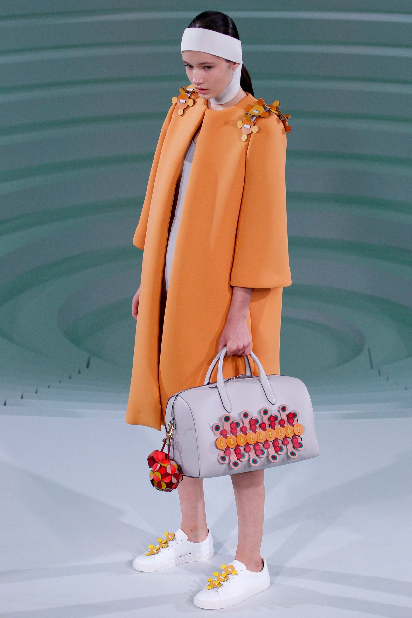 orange wool coat with white dress
