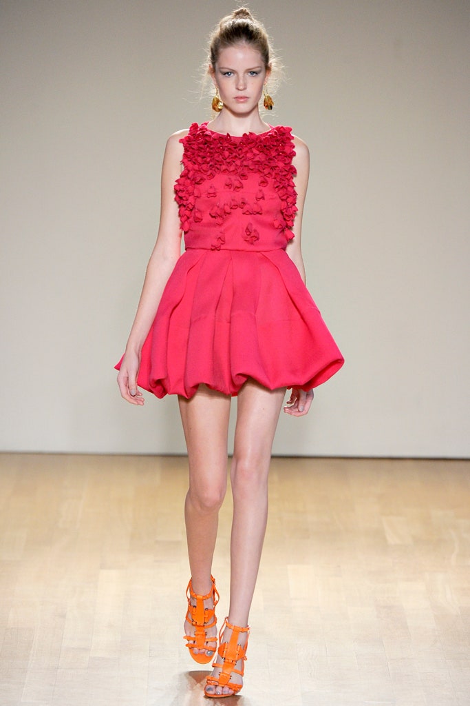 pink ruffled mini dress with orange shoes
