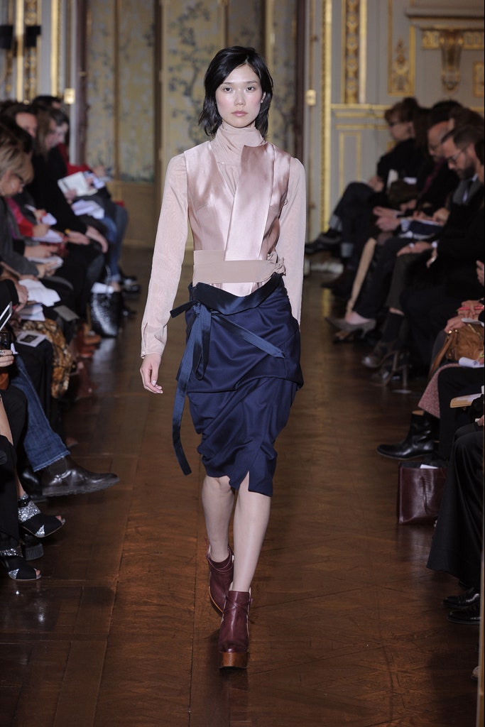 beige silk sleeveless top with navy skirt