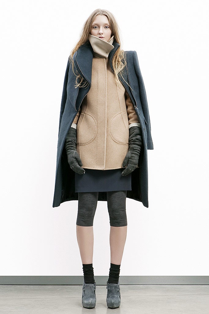 black wool coat beige top