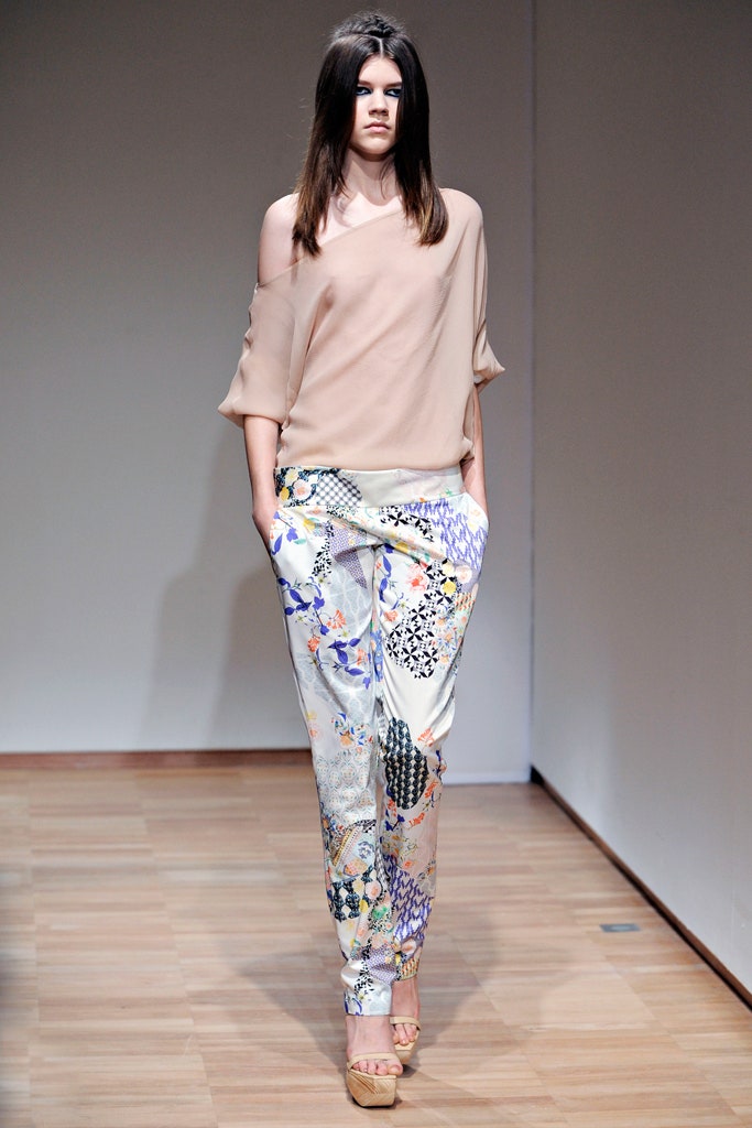 beige silk off-shoulder top with multi-colored pants