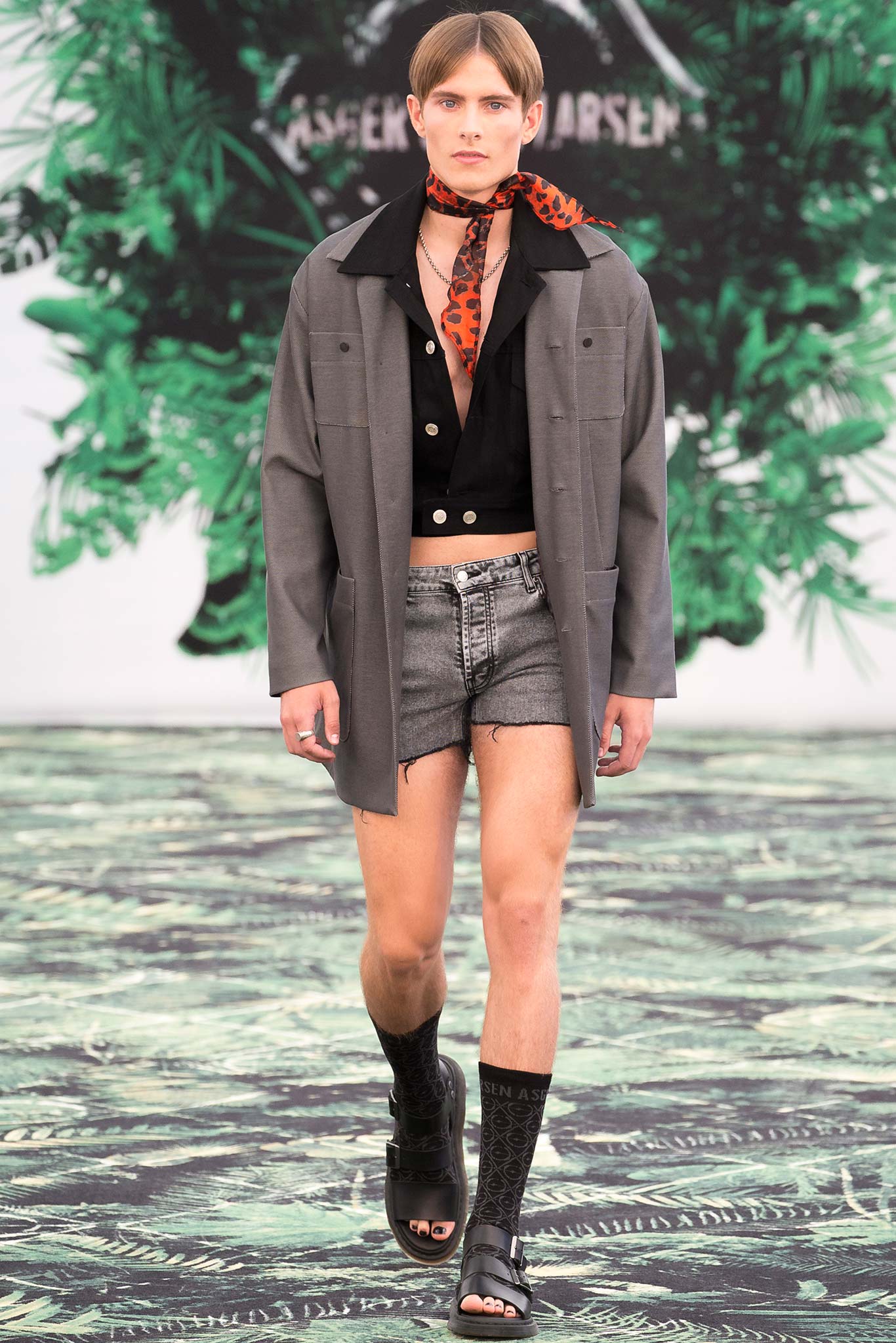 gray jacket black shirt denim shorts