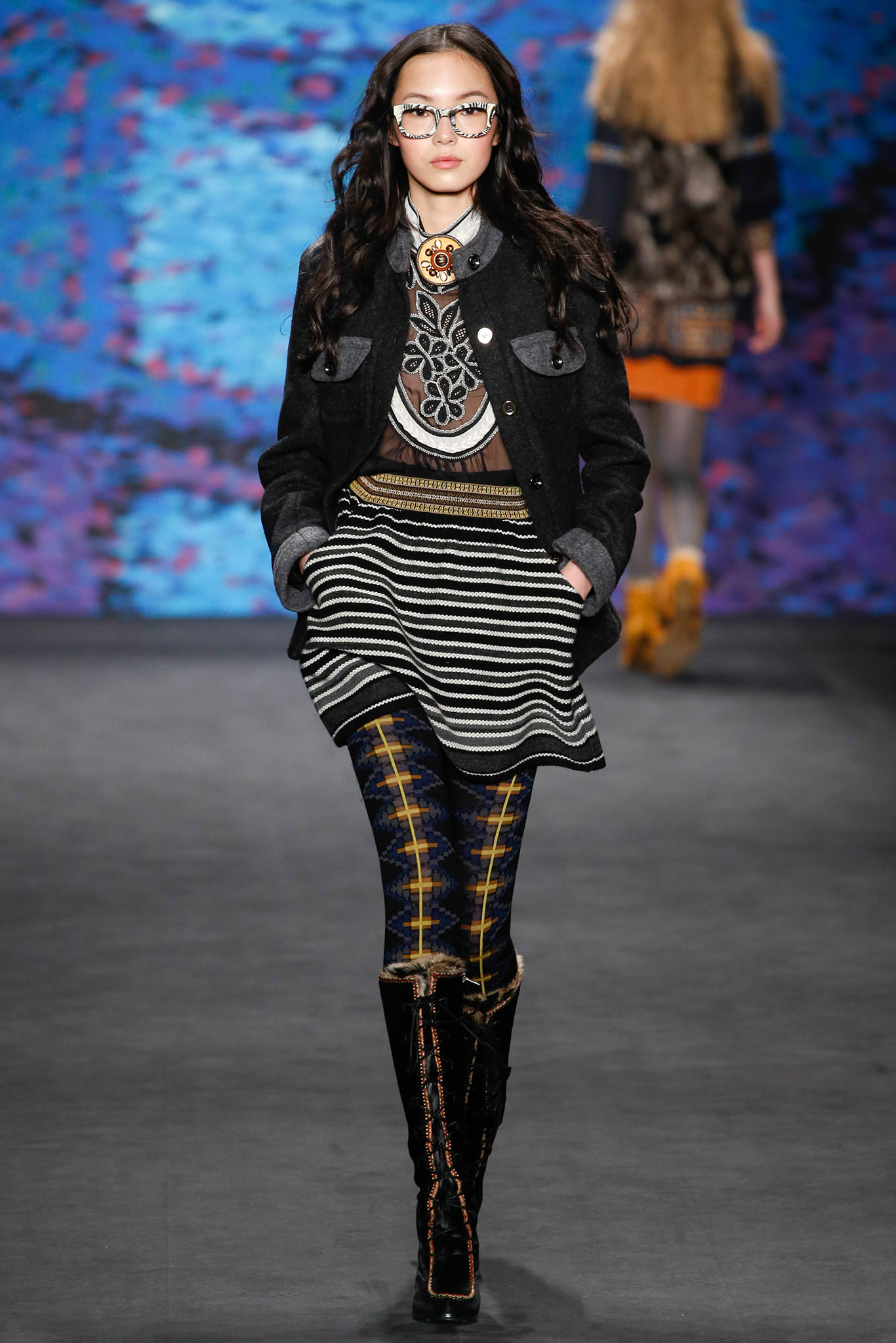 black wool fitted jacket with pleated skirt