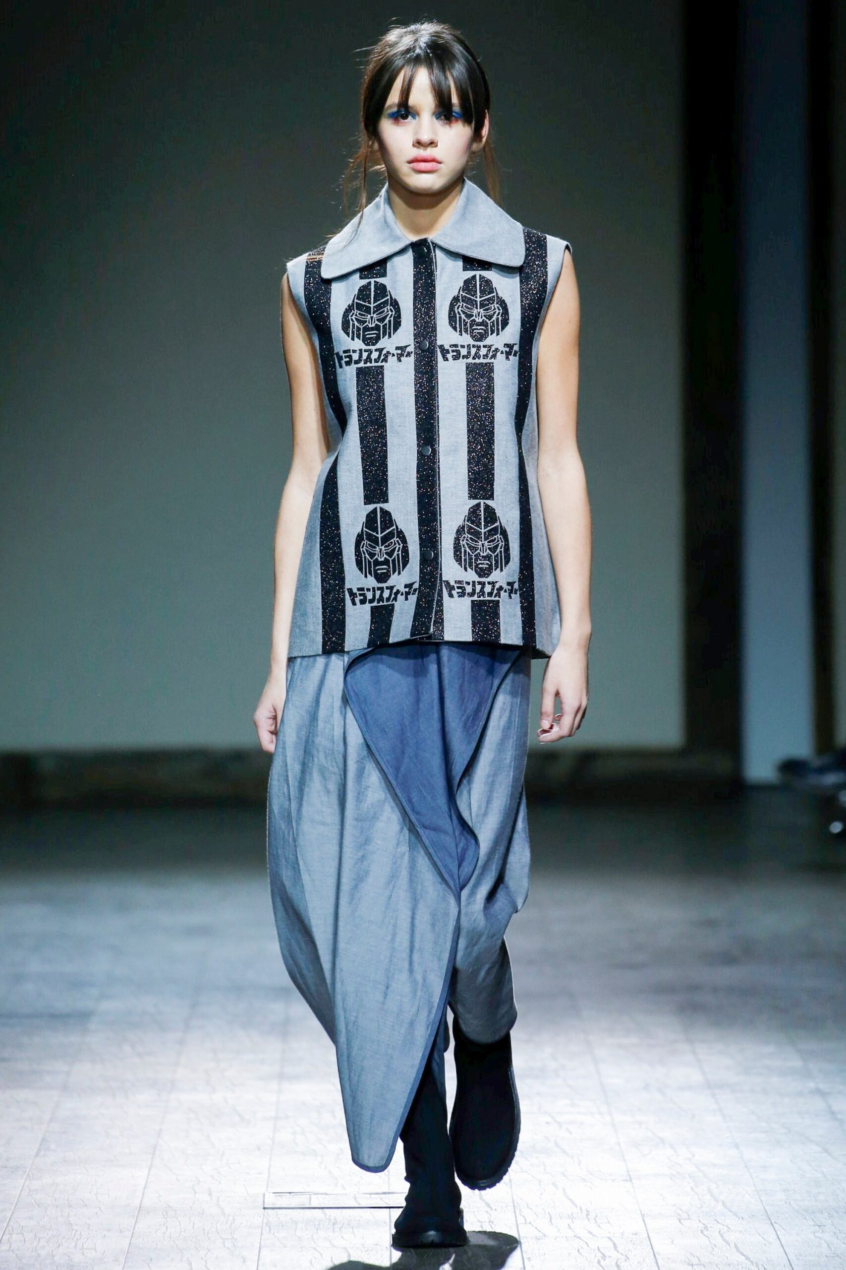 black and white printed top with blue draped skirt
