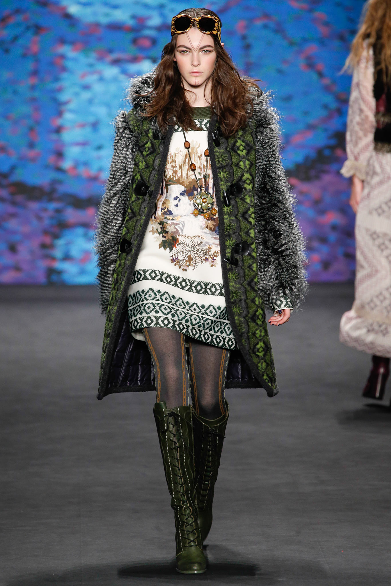 green fur coat with printed dress