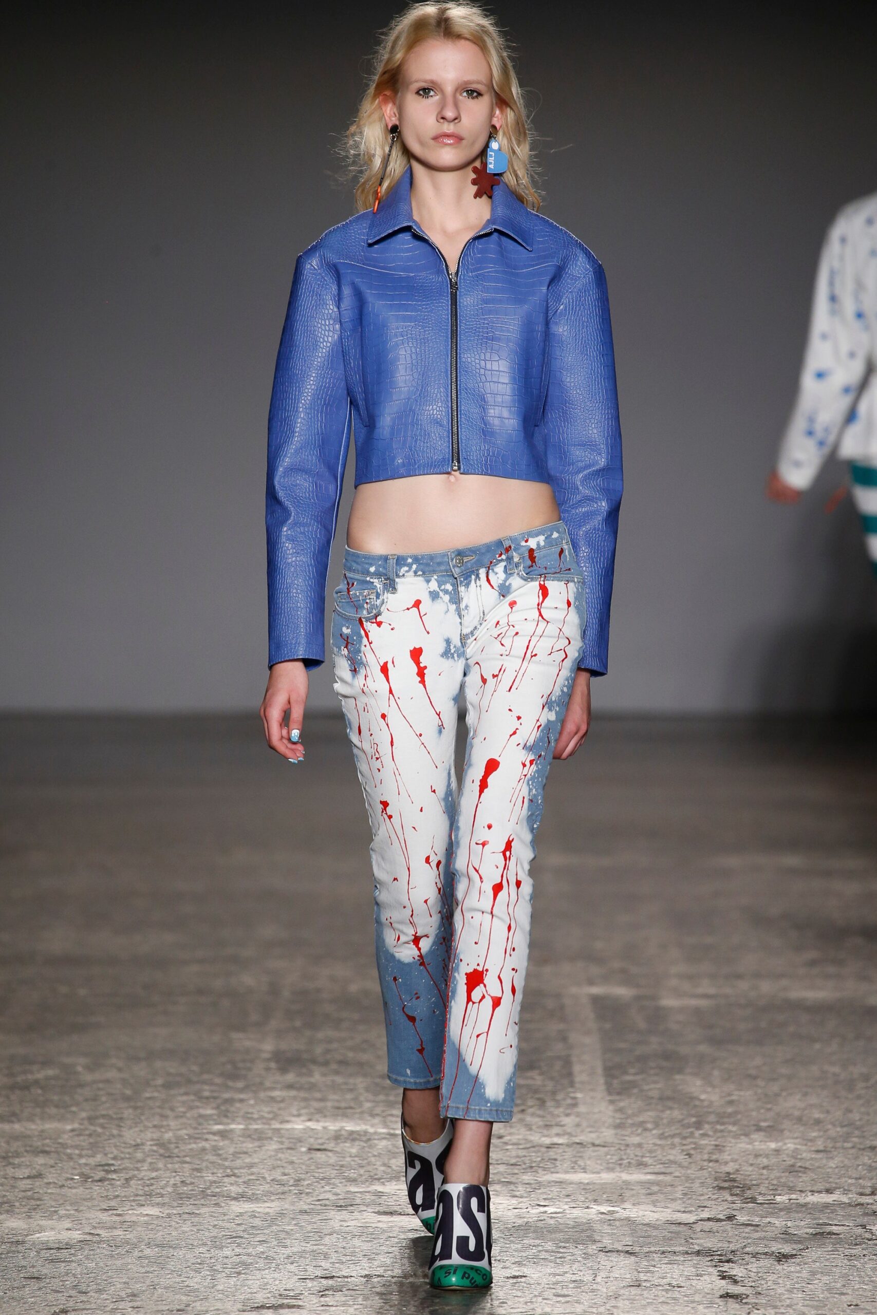 blue vinyl fitted jacket with distressed pants