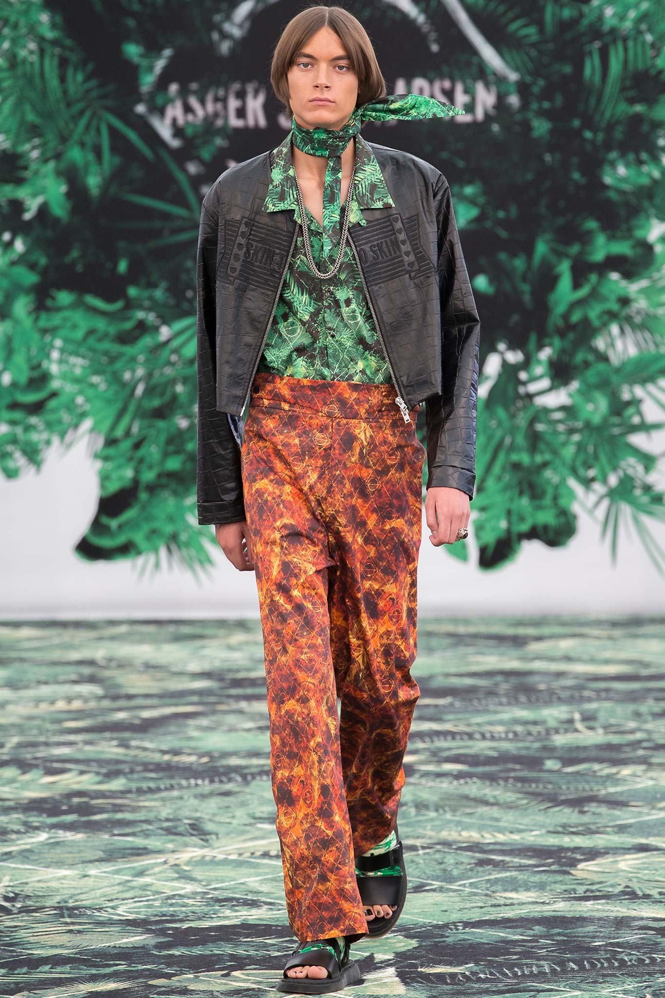 black leather jacket green shirt orange pants