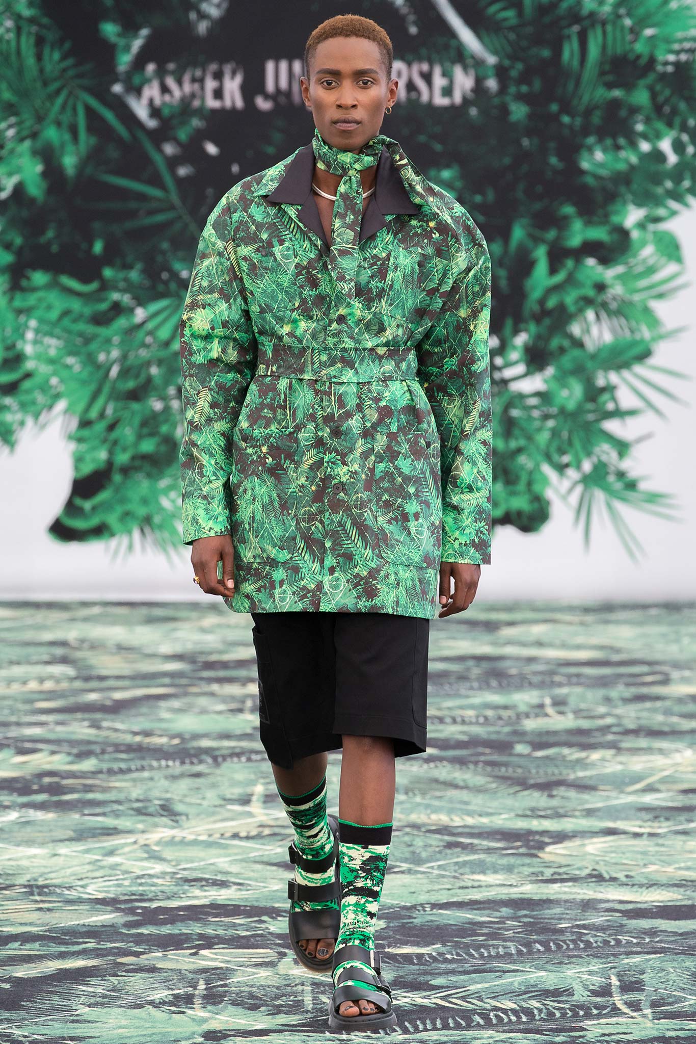 green printed coat with black shorts