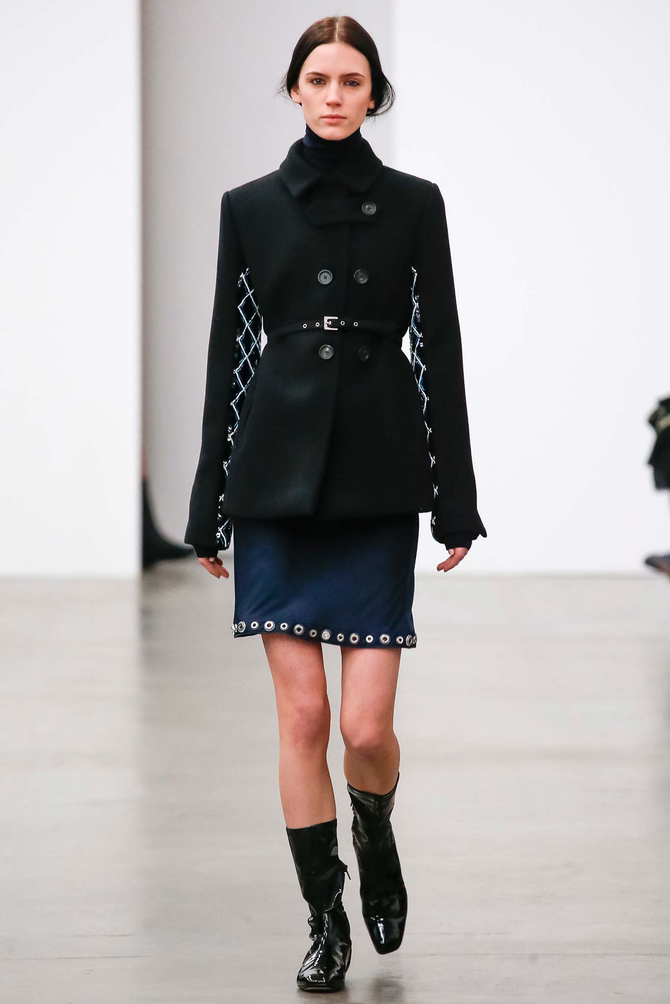 black fitted jacket with blue mini skirt