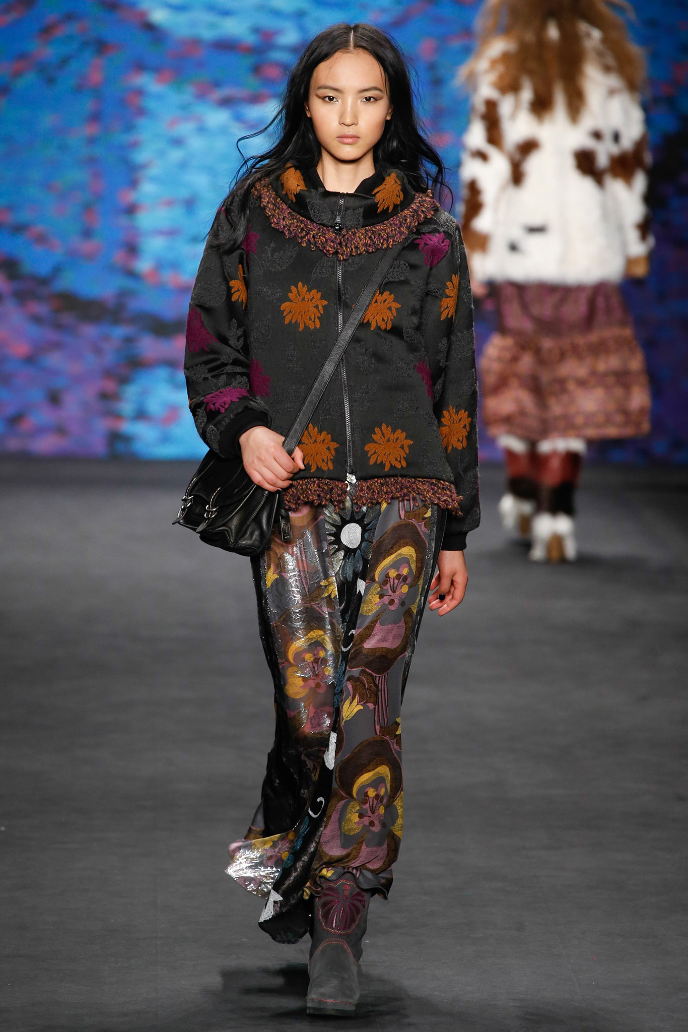 embroidered black jacket with flared pants