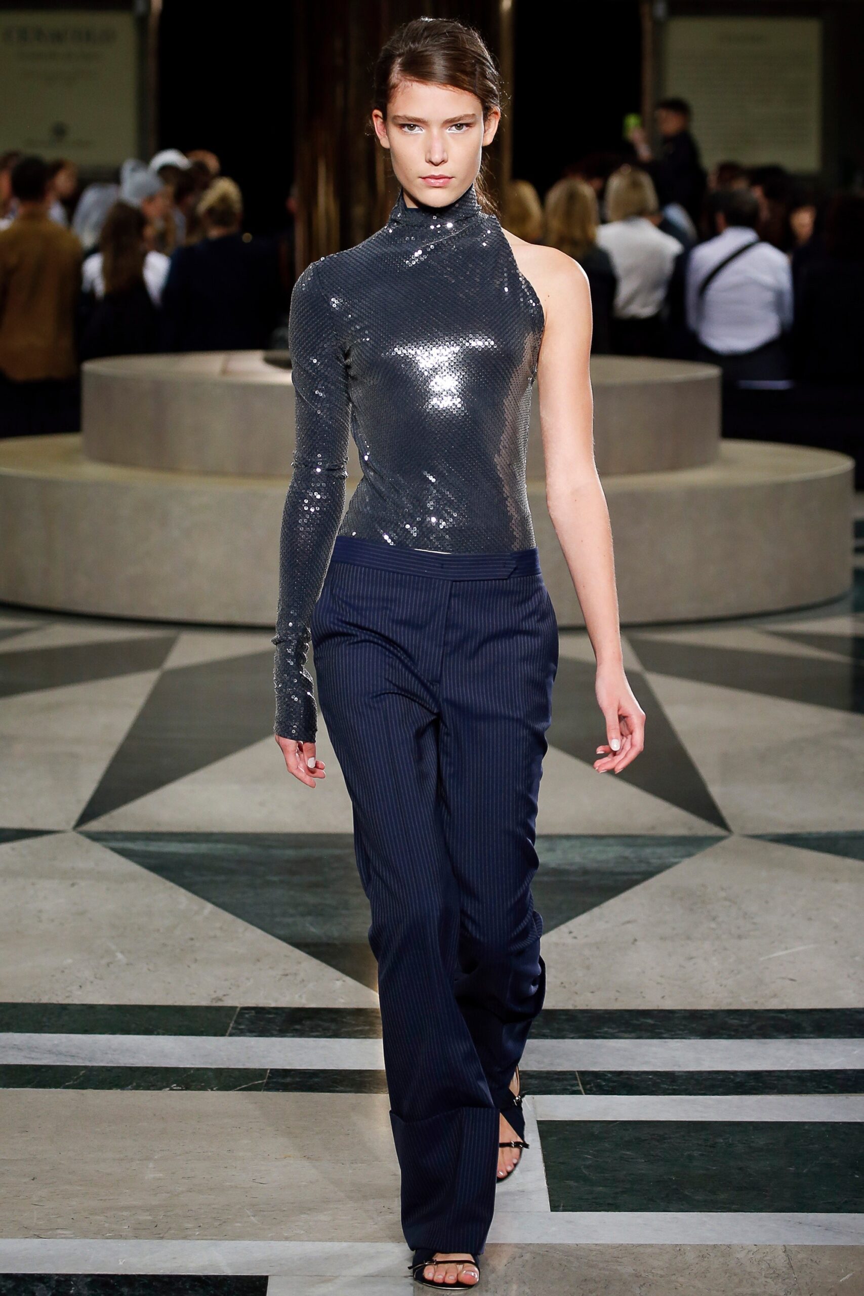 shiny silver asymmetric top with tailored pants