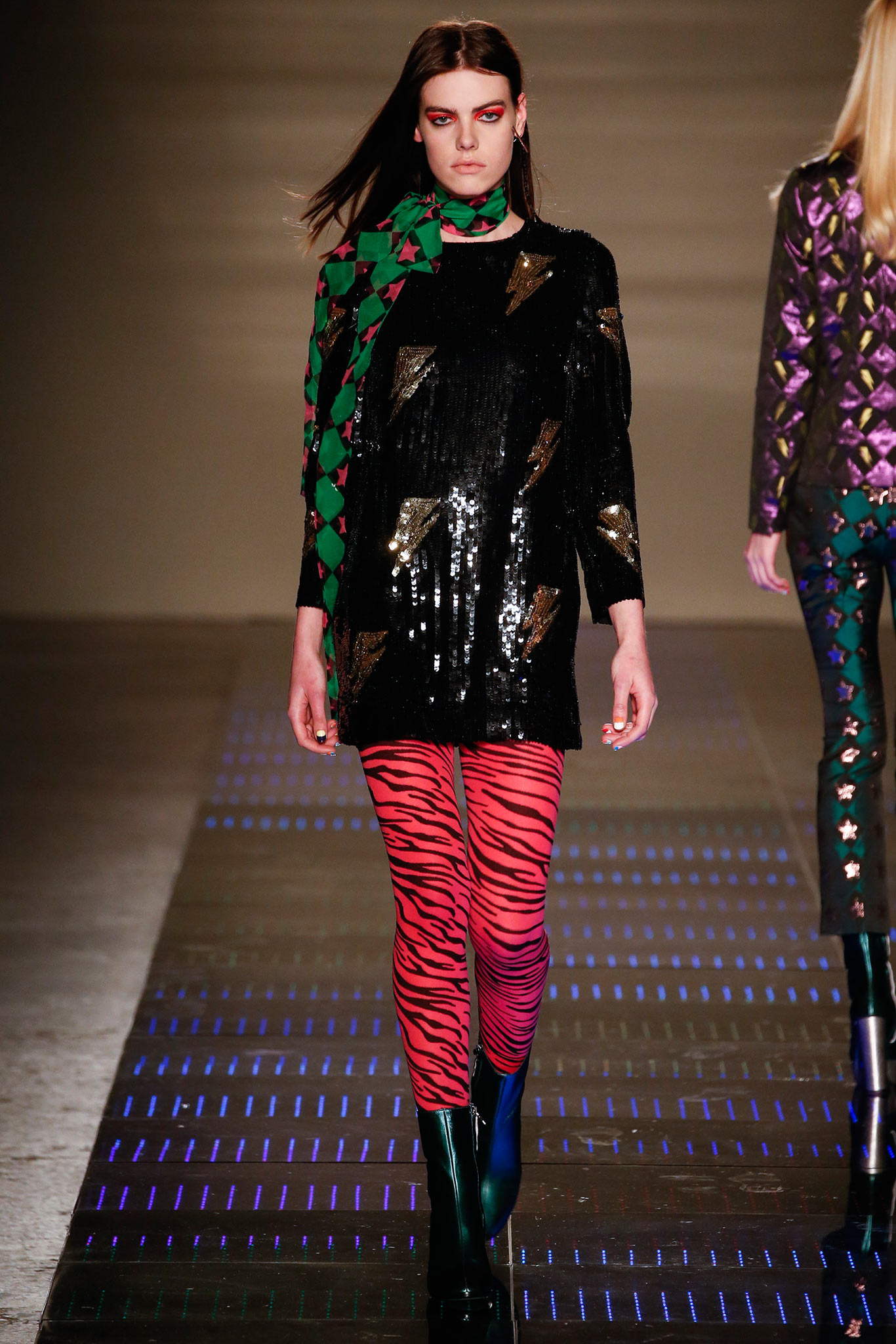 black sequin dress with animal-print leggings