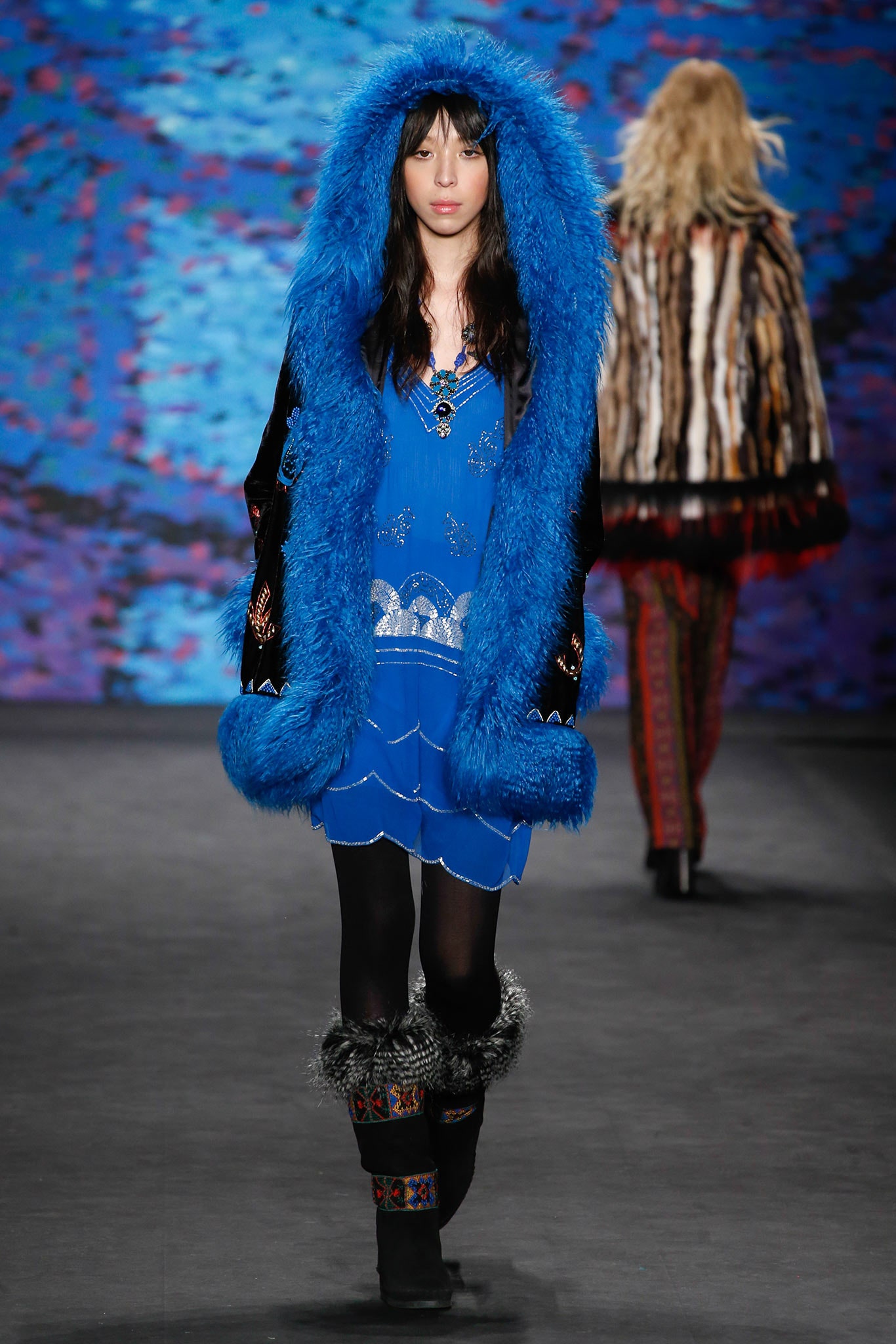 blue silk sleeveless dress with faux-fur coat