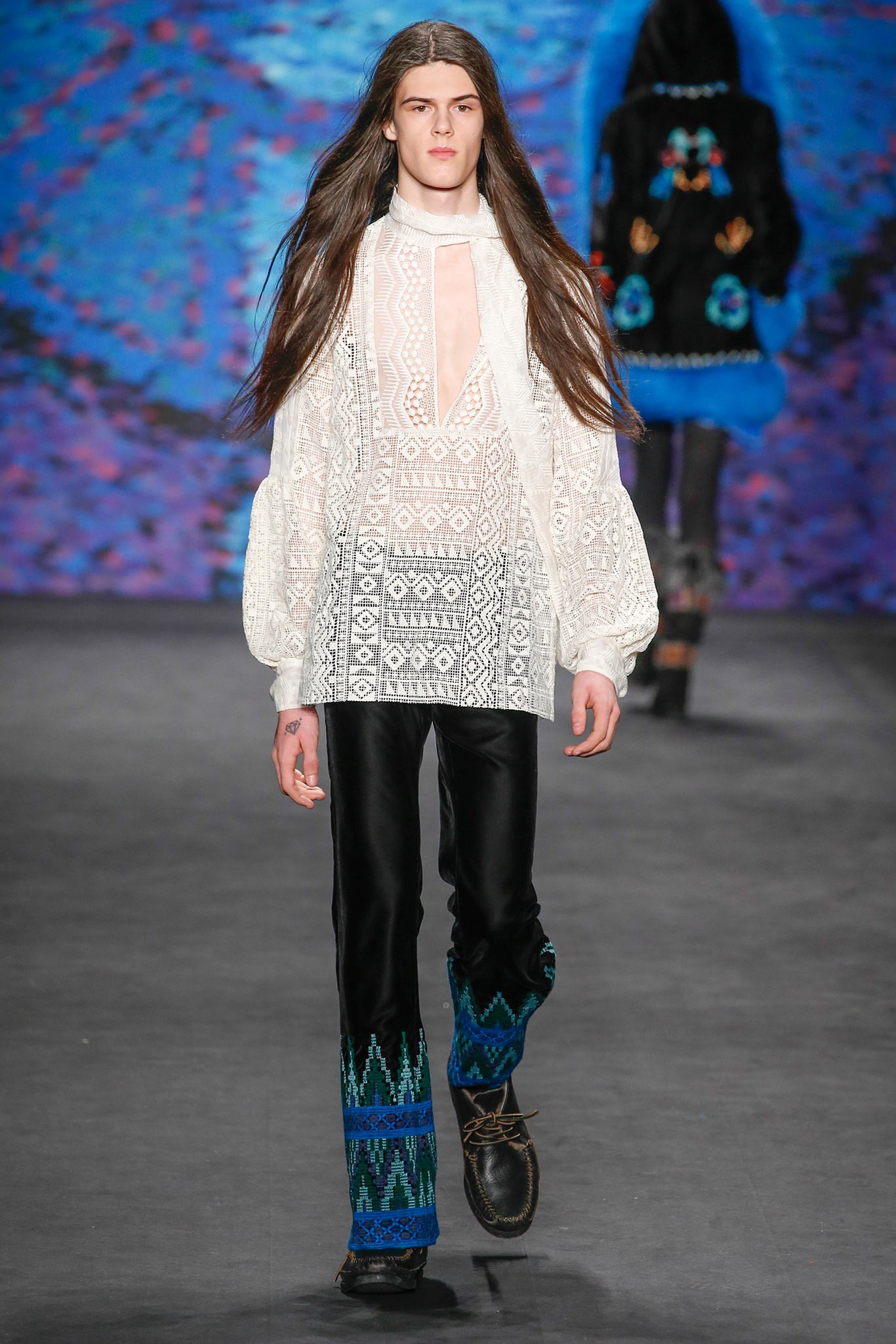 white embroidered blouse and black pants