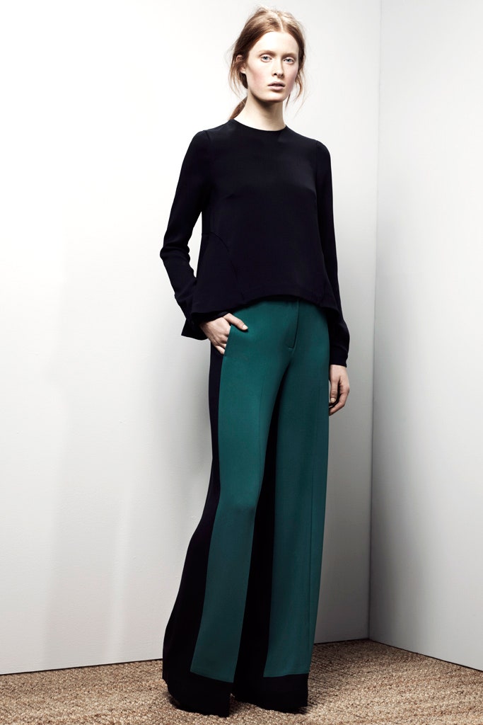 black fitted top with green pants