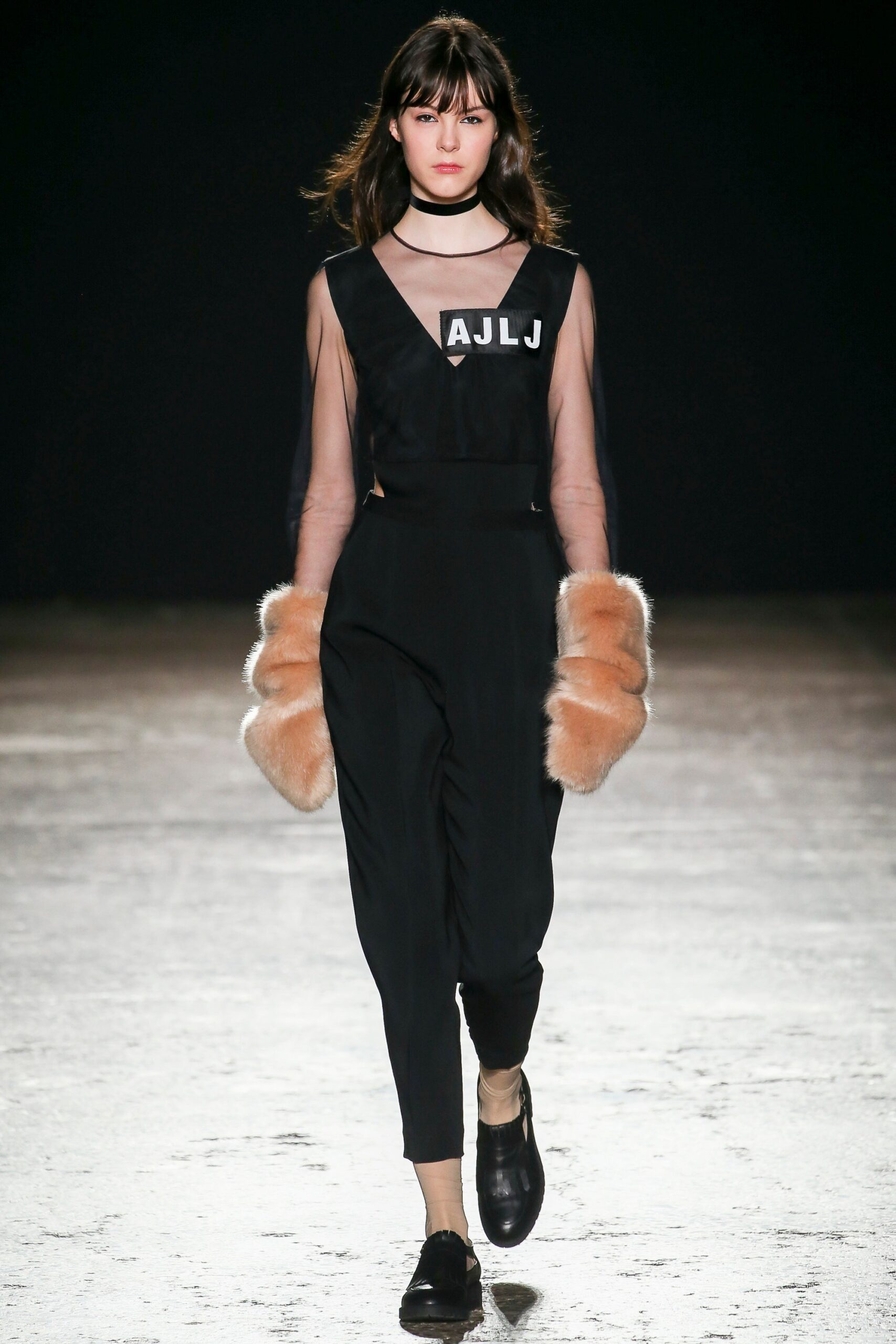 black fitted jumpsuit with faux-fur accessory