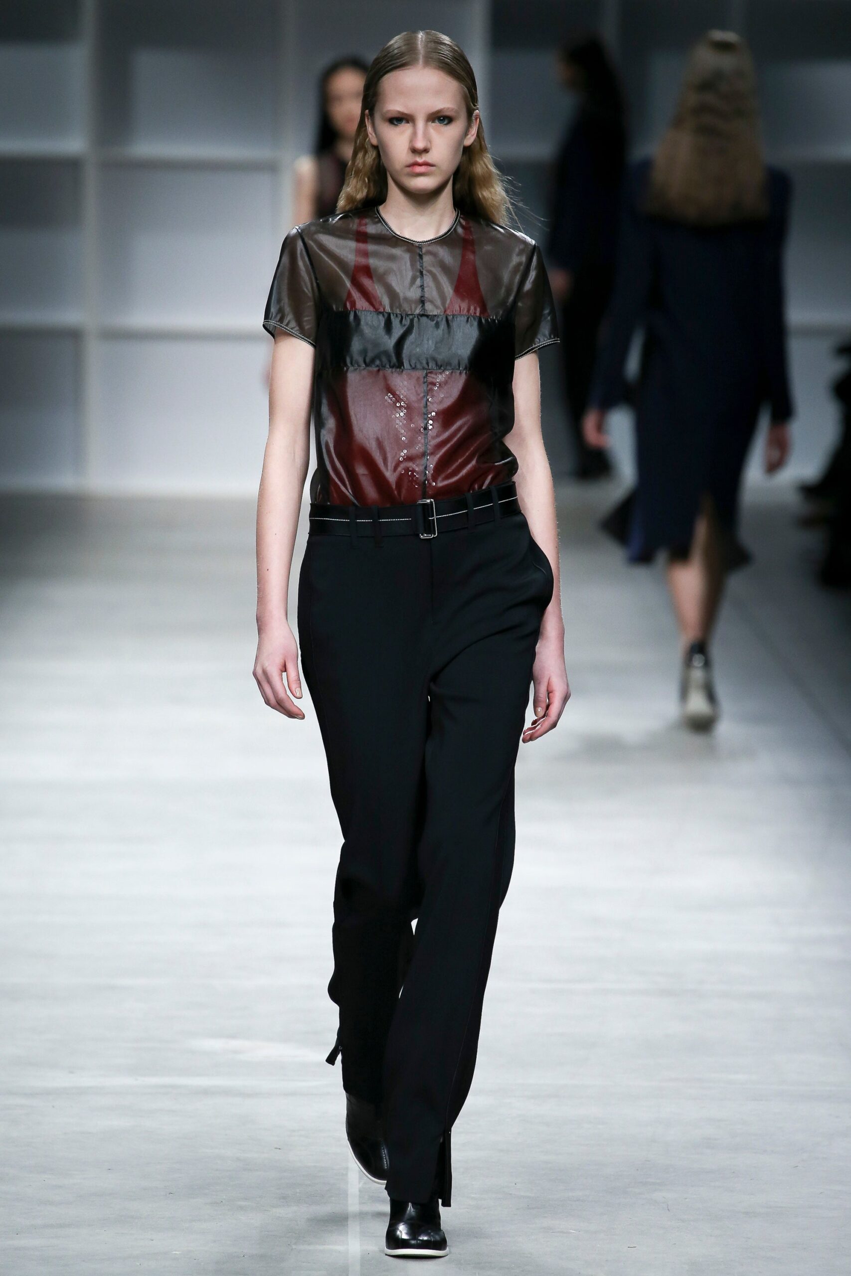 fitted black and red top with slim pants