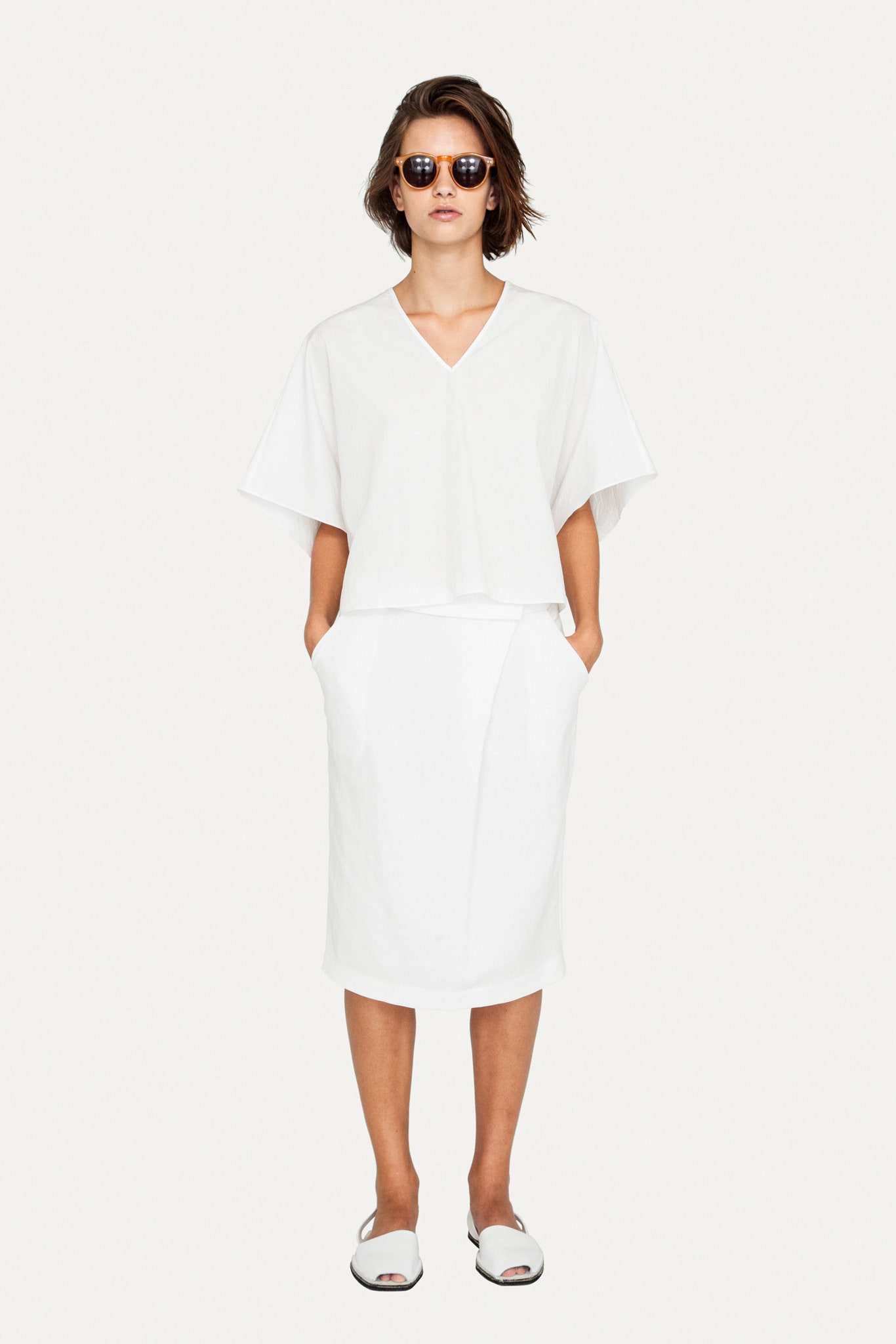 white relaxed top and fitted skirt