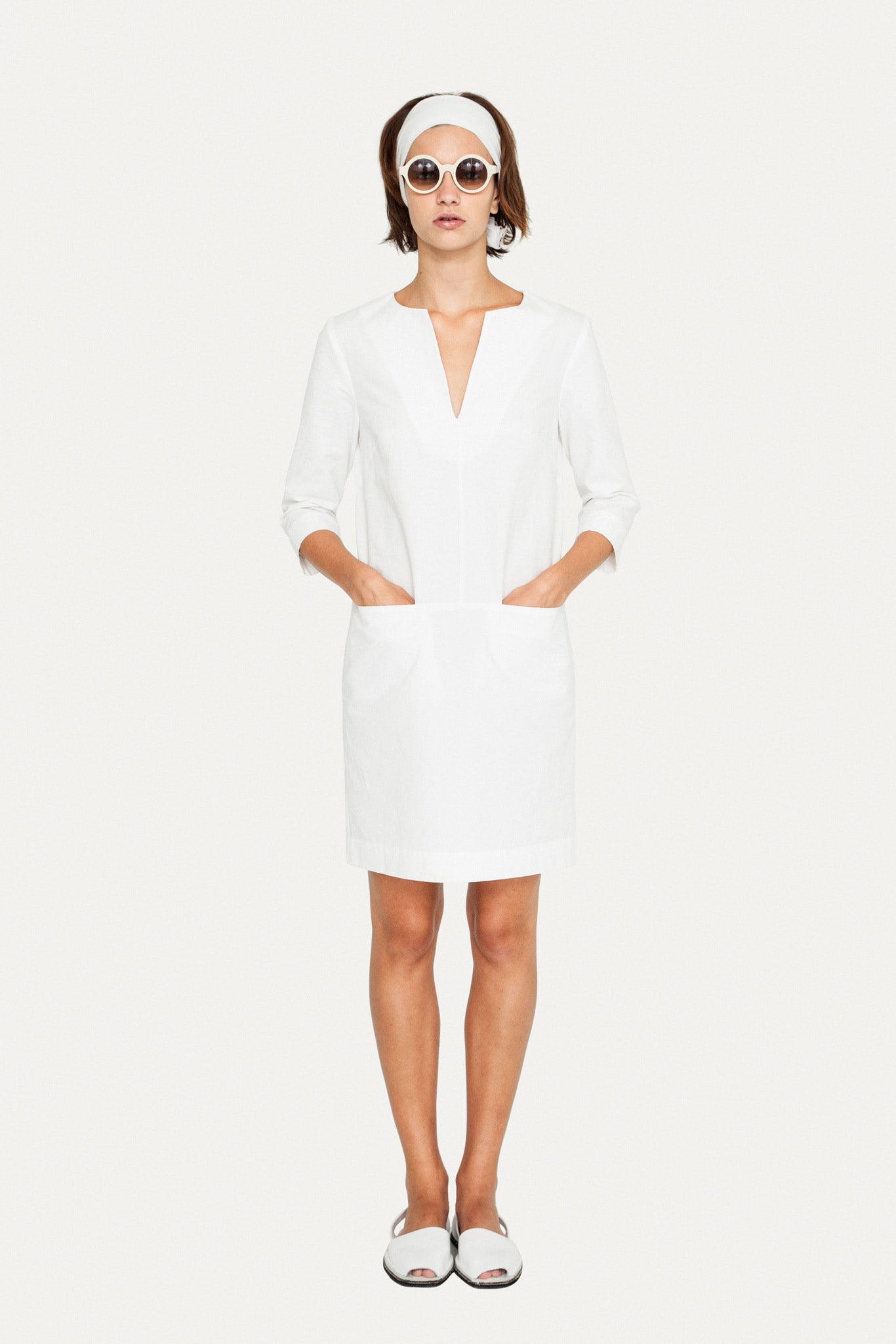 white fitted dress with pockets