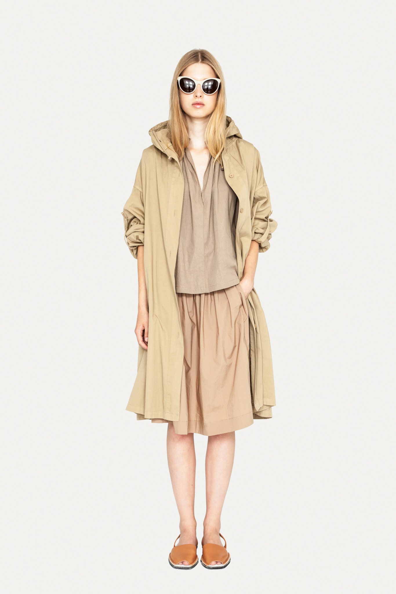 beige coat with brown top and midi skirt
