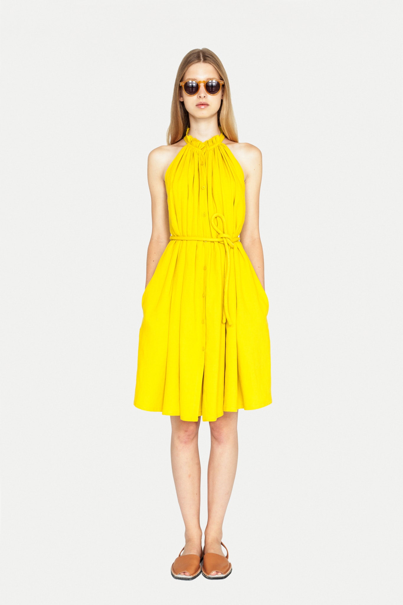 yellow cotton sleeveless halter fitted pleated belted dress